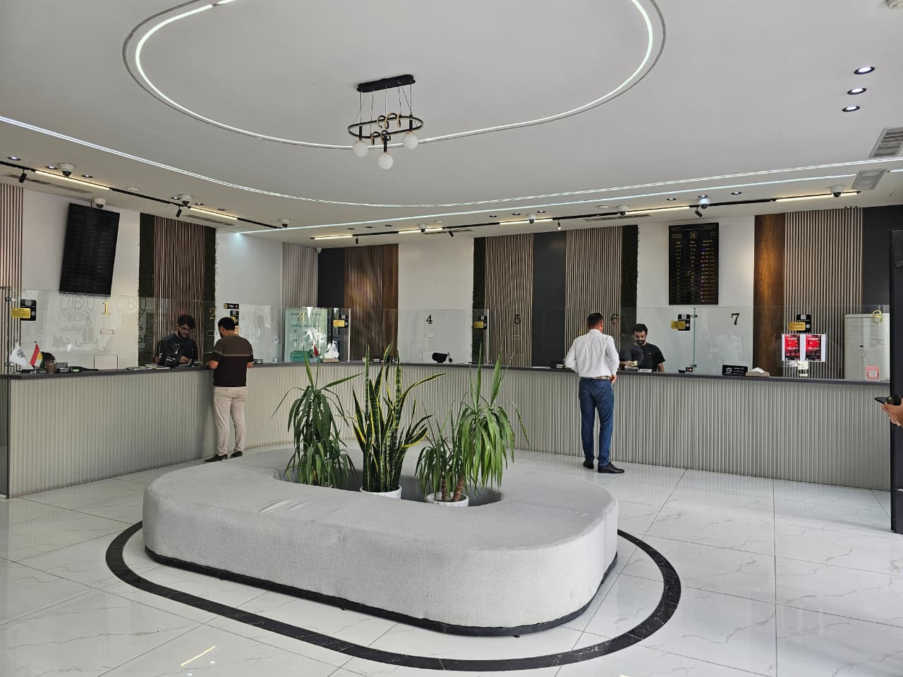 The main hall at Baxi Douz, with counters 1 to 8 along the back wall